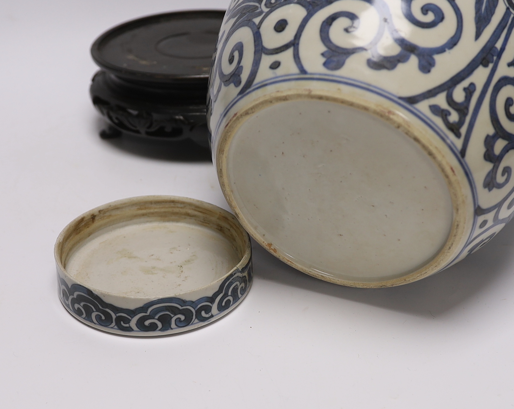 A 19th century Chinese blue and white jar and cover, with stand, 29cm total (including stand)